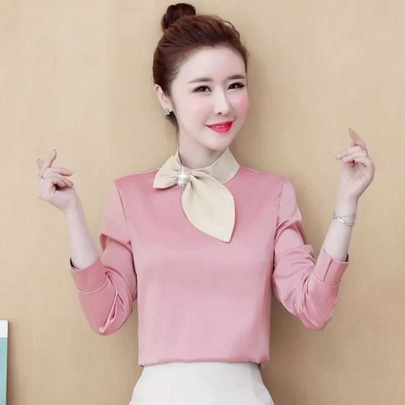 Pink long-sleeved satin blouse with beige bow