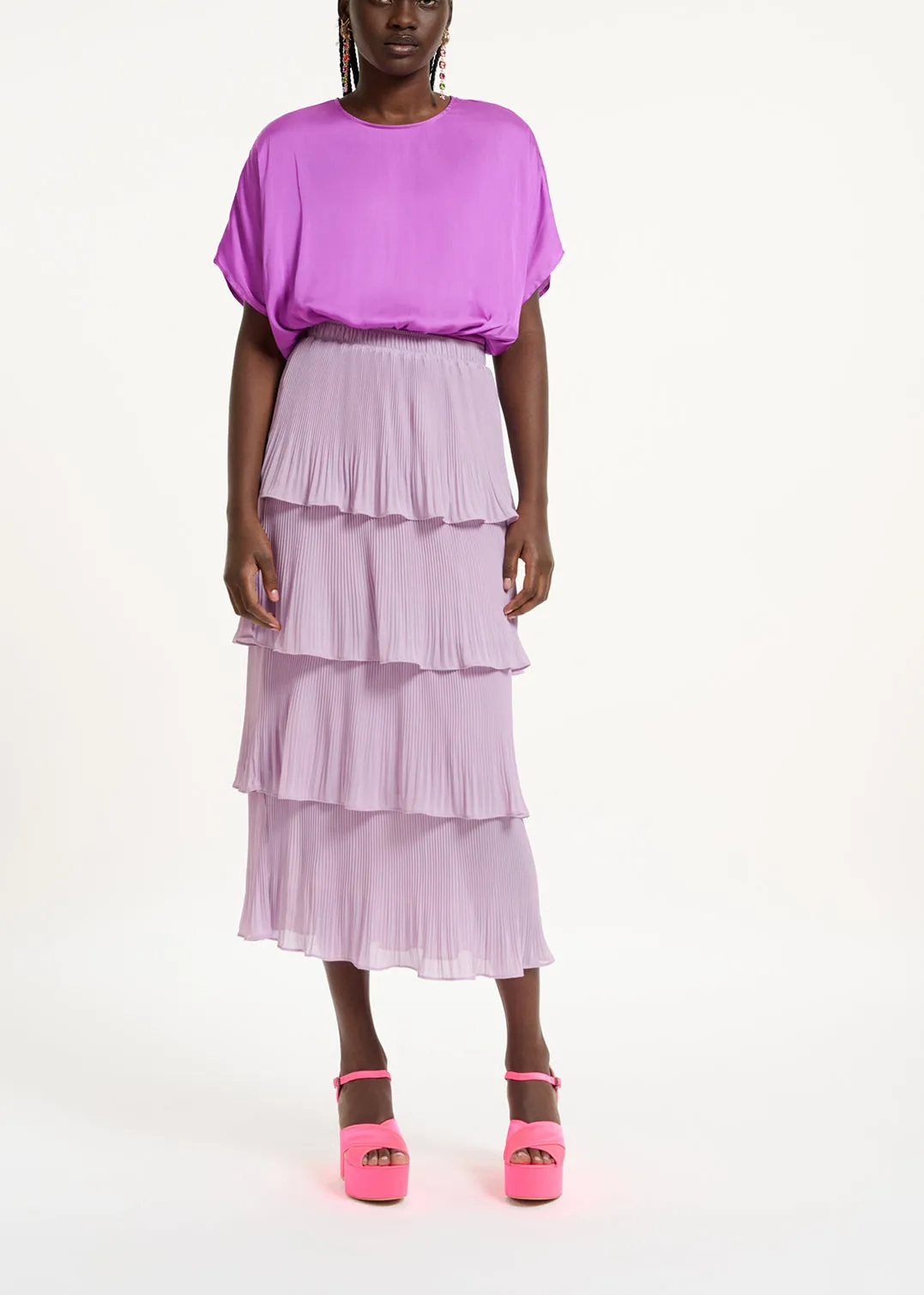 Purple short-sleeved top with rhinestone-encrusted buttons