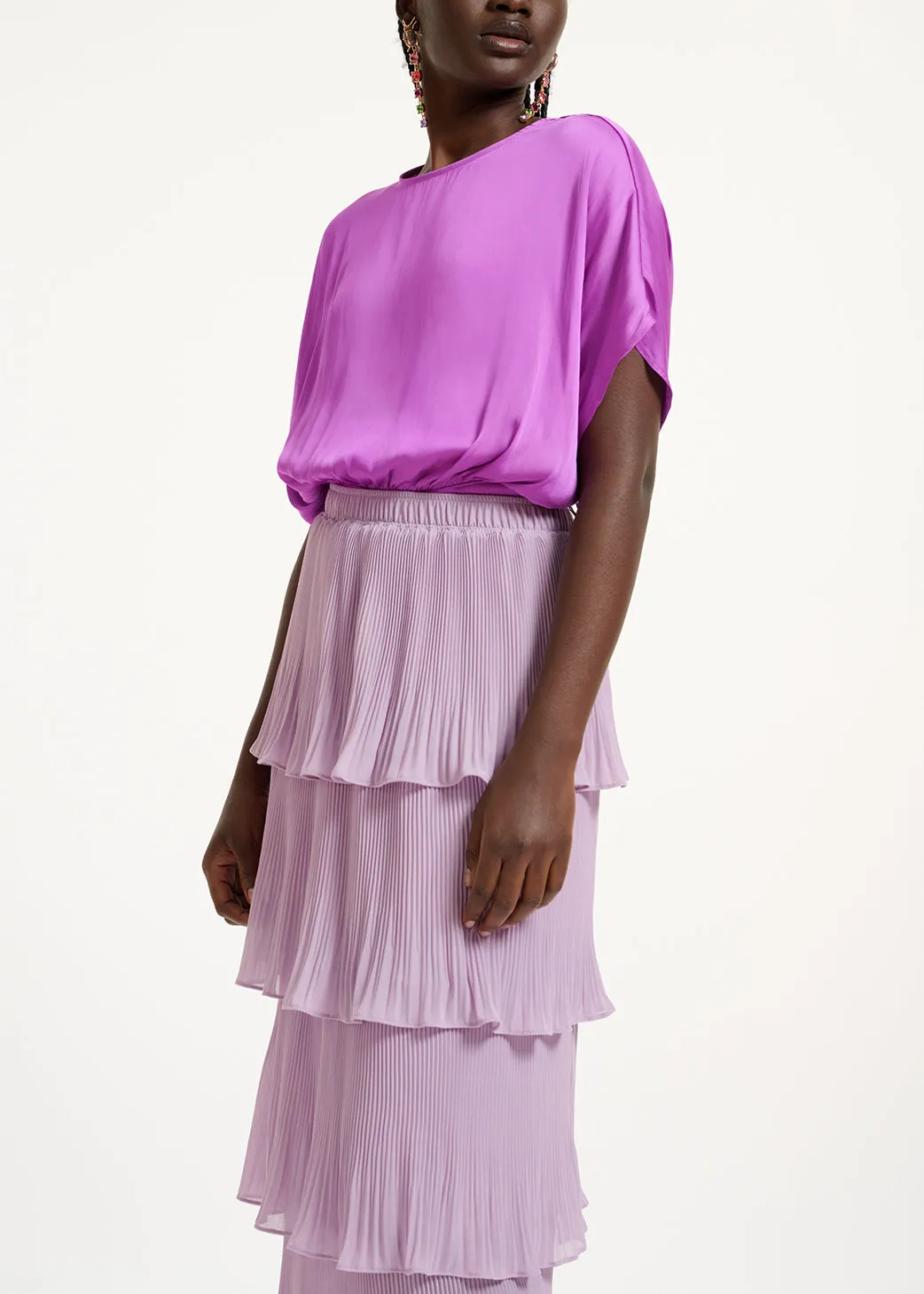 Purple short-sleeved top with rhinestone-encrusted buttons
