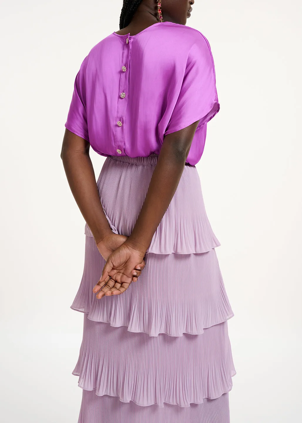 Purple short-sleeved top with rhinestone-encrusted buttons