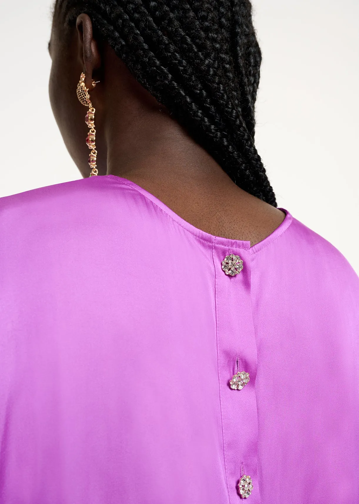 Purple short-sleeved top with rhinestone-encrusted buttons
